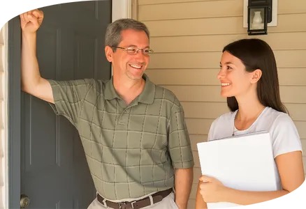 Tim Cureton greeting a new client at the office door